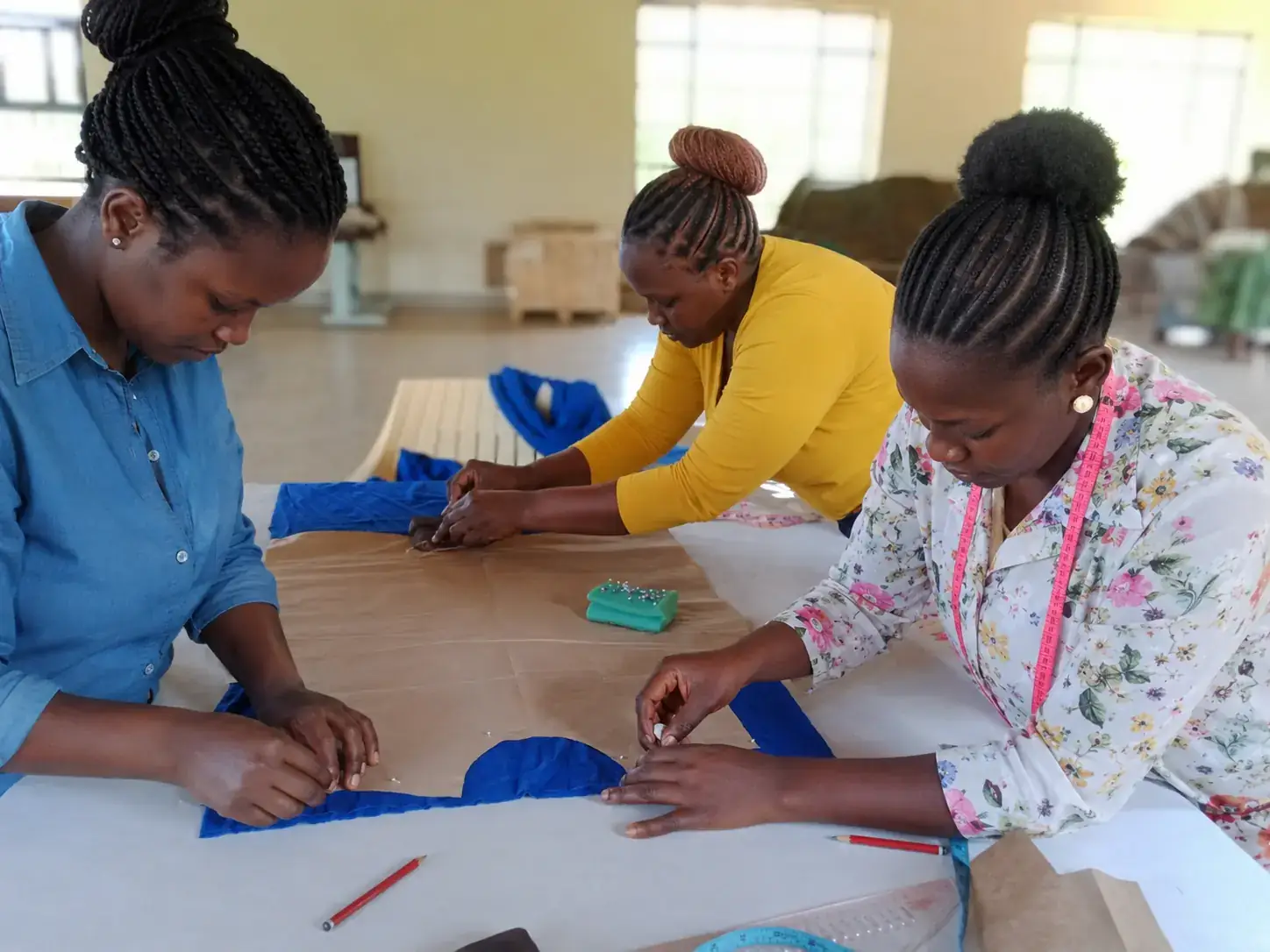 Privacy-safe image of Kenyan women participating in garment-skills learning